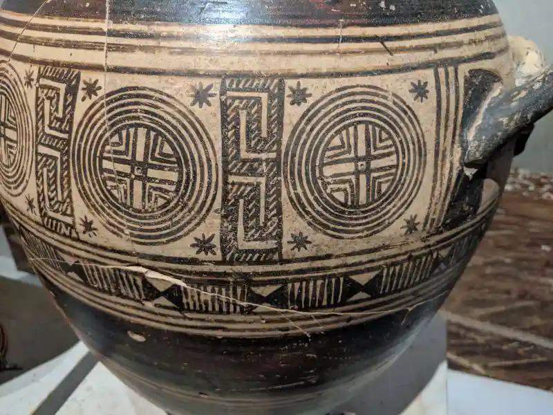 Ancient Greek funerary amphora decorated with encircled crosses and geometric patterns from Early Iron Age